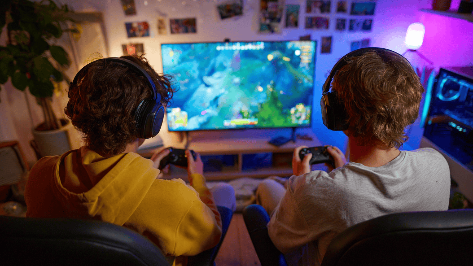 teenagers playing video games in room